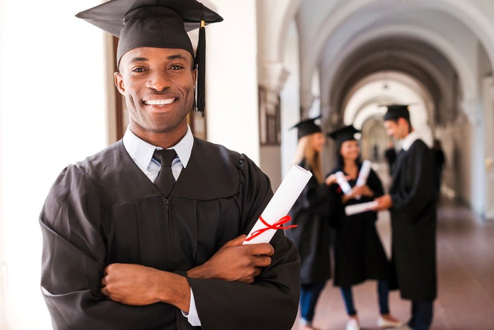 college graduate holding his diploma | Stevens Creek Subaru in Santa Clara CA